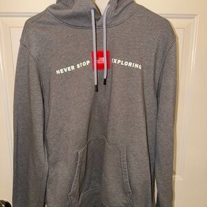 The North Face Gray Hoodie with 'Never Stop Exploring' Logo